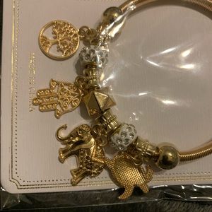 Gold overlay jewelry. Individual charms bracelet. Elephant and other charms.